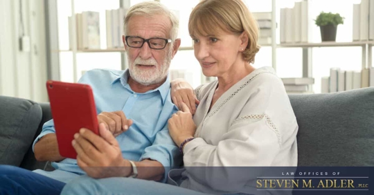 Older couple looking at tablet